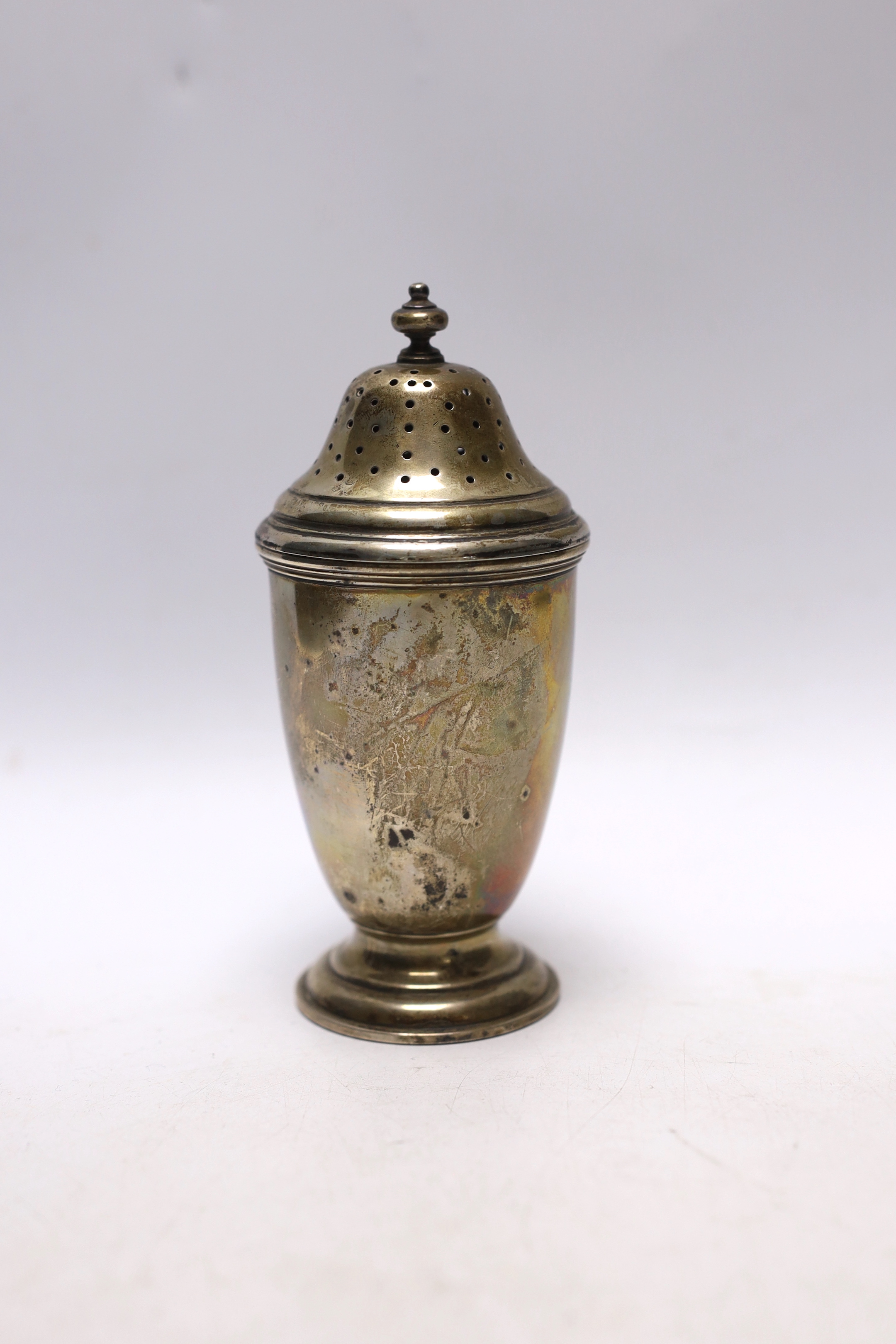 An Elizabeth II silver sugar caster, Wakely & Wheeler, London, 1955, 14.7cm, 5.7oz.